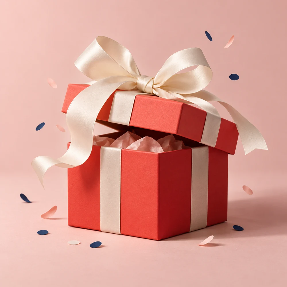 A coral gift box with an ivory ribbon